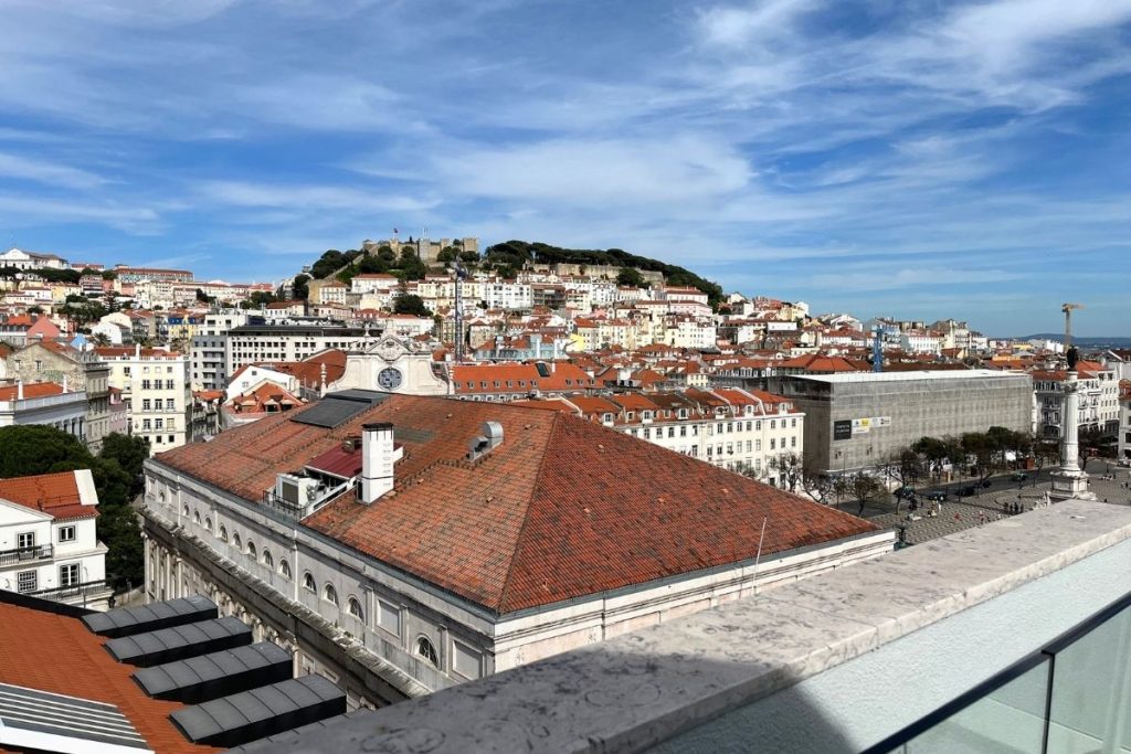 Views of the city of Lisbon, including the Castle of St. George, as seen from a rooftop bar of a hotel