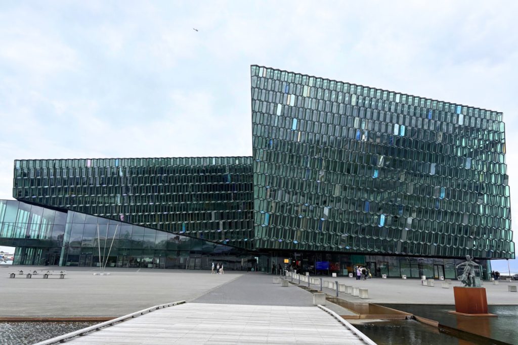 Honeycomb glass facade of Harpa Concert Hall under a gray sky