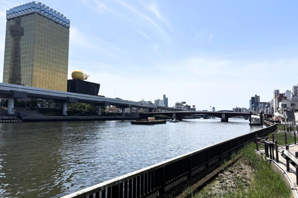 The Sumida River with the Asahi Beer Hall's gold building and flame sculpture in view