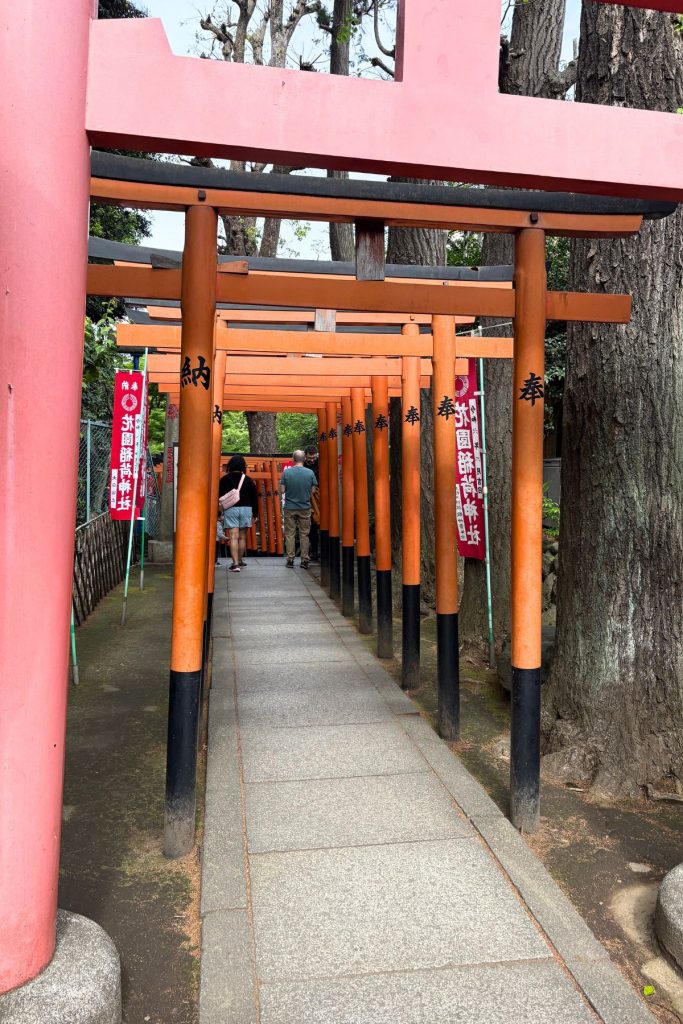 Red torii gate tunnel at Hanazono Inari Shrine in Ueno Park