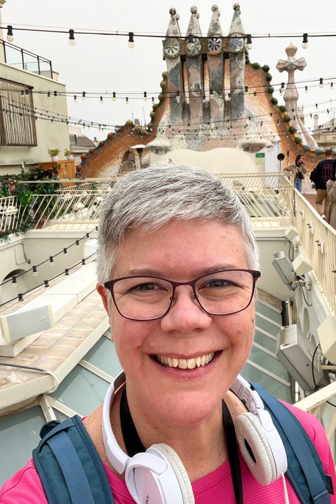 Selfie on Casa Batlló rooftop with mosaic chimneys in background