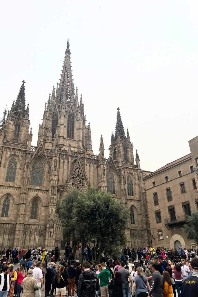 Barcelona Cathedral Gothic facade with crowd gathered in plaza