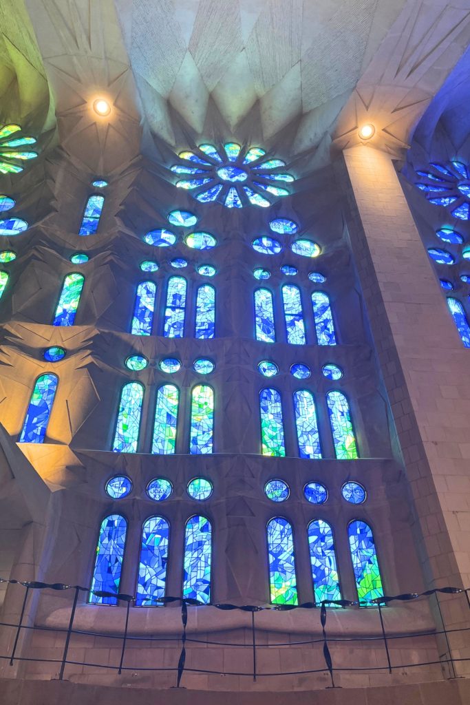 Sagrada Família stained glass window in blue and green tones