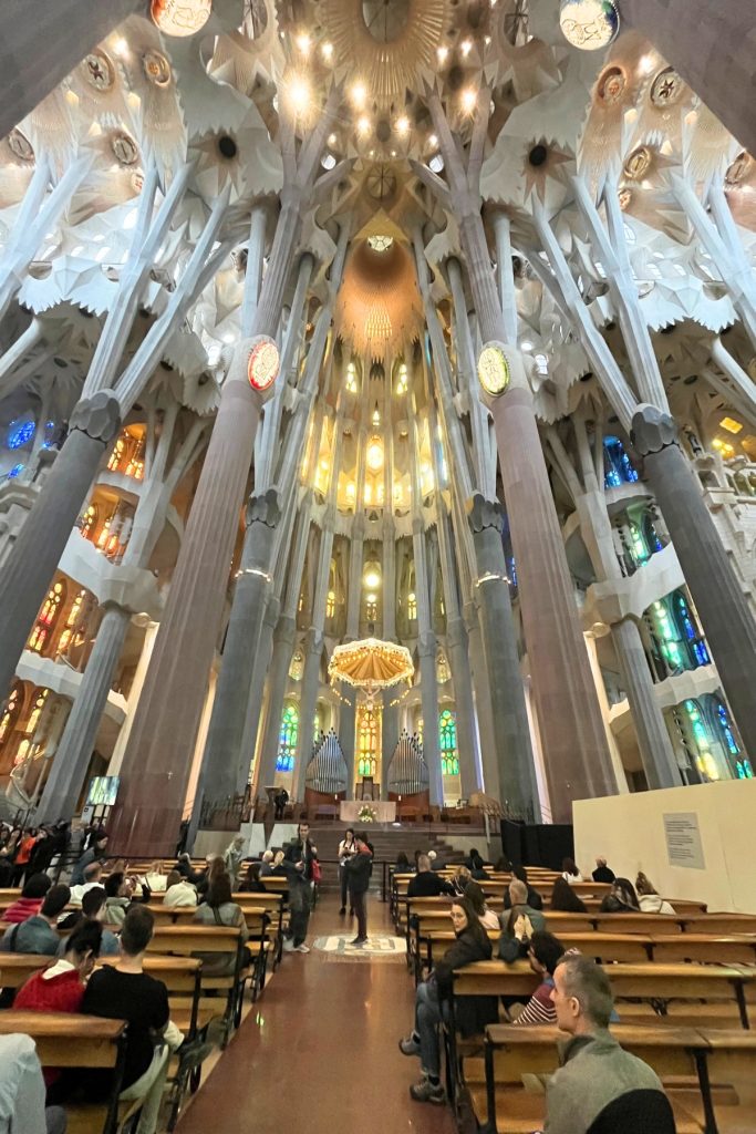 Sagrada Família interior nave with tree-like columns and stained glass windows