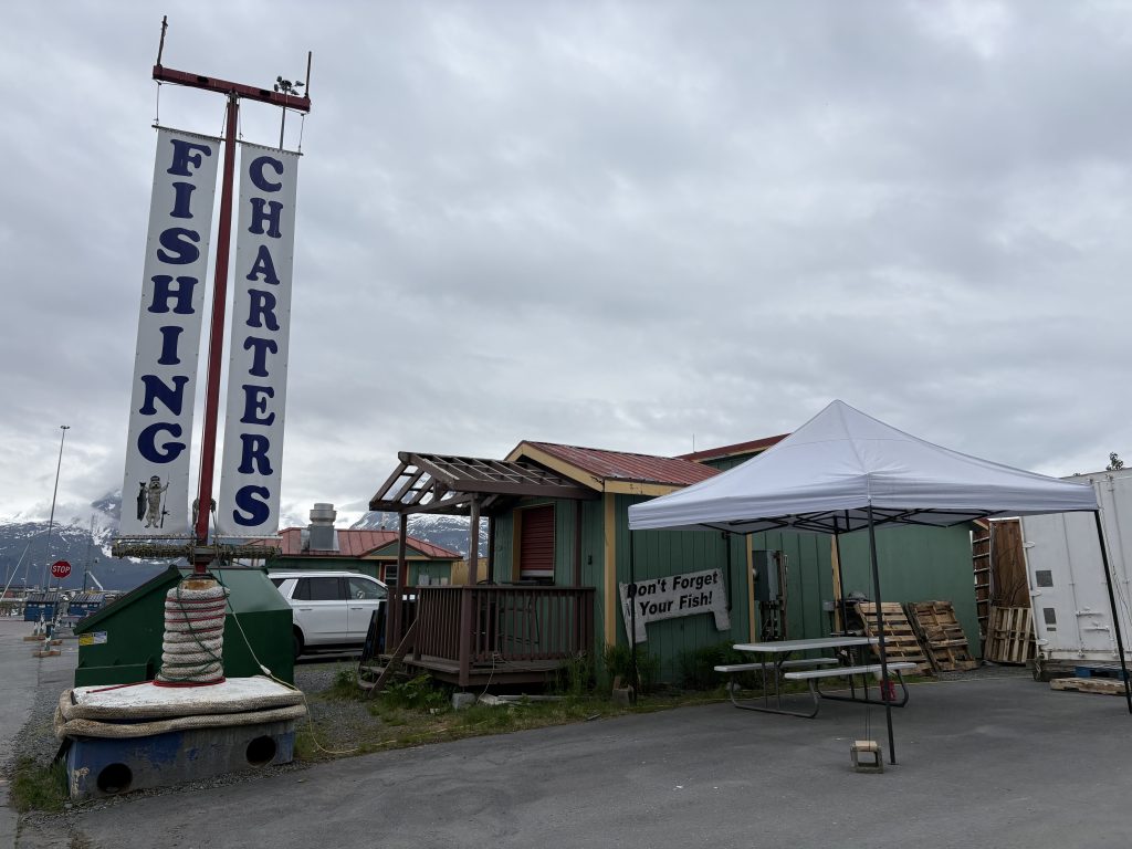 Fishing charter shack with a "Don't Forget Your Fish" sign in Valdez, Alaska