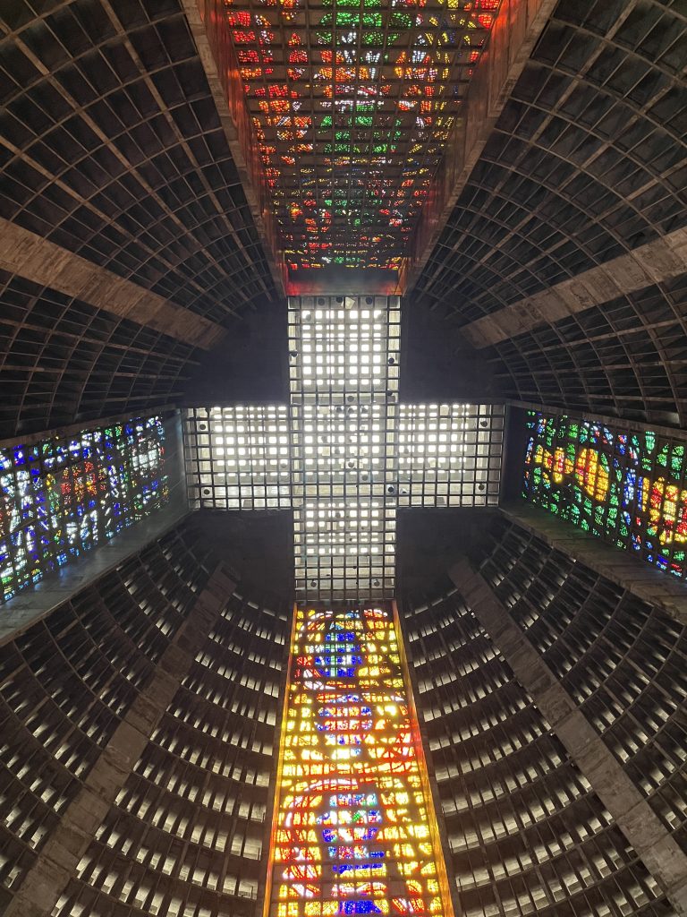Interior view looking up at the cross-shaped skylight formed by stained glass in the Metropolitan Cathedral of Rio de Janeiro