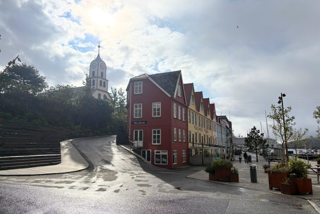 Colorful row houses and a white clock tower in Tórshavn's old town, Faroe Islands