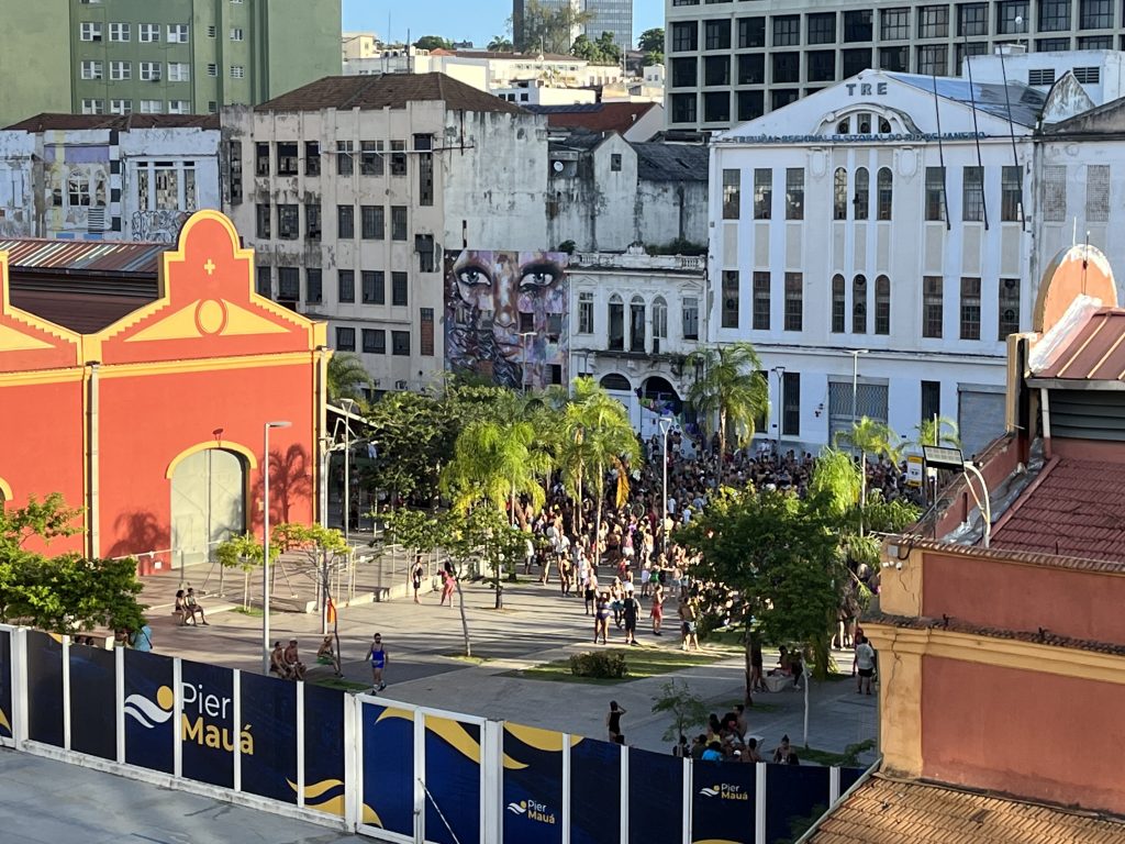 Aerial view from a cruise ship balcony of a Carnival crowd gathered at Pier Mauá in Rio de Janeiro
