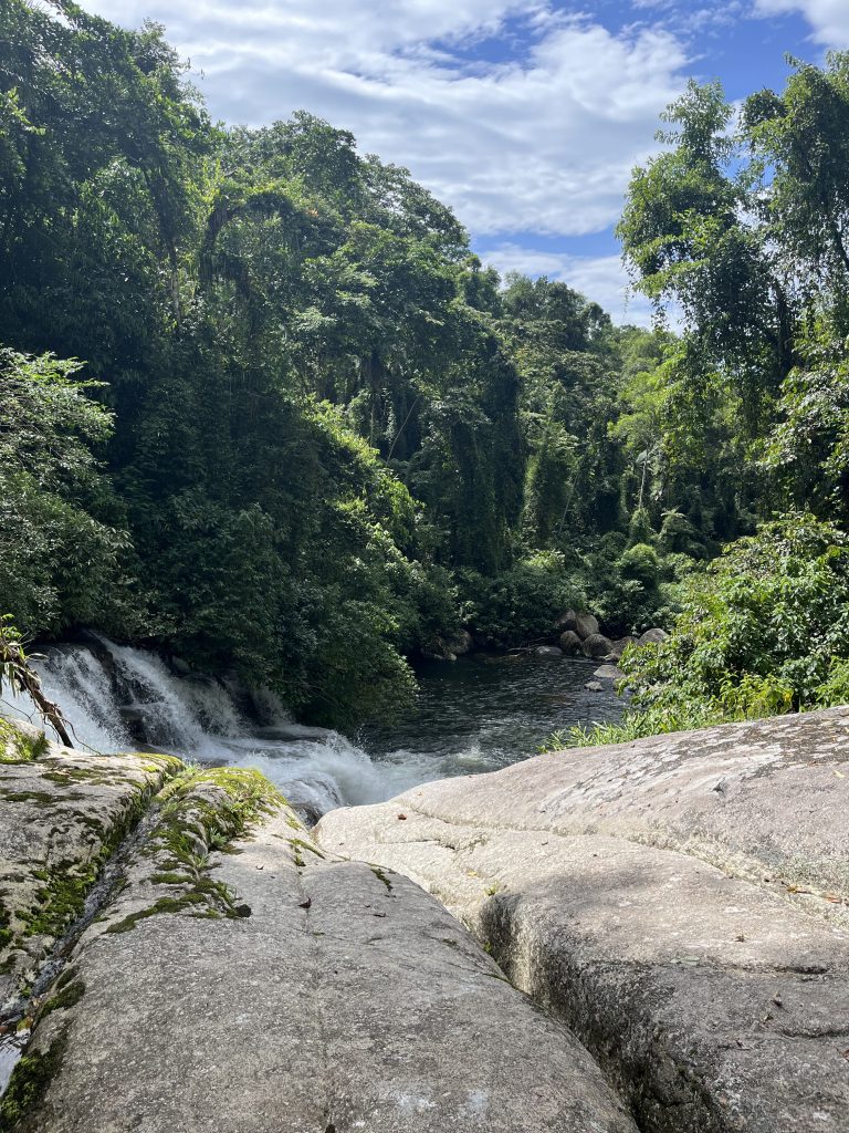 Wide view of the river and jungle canopy from the rocks above Pedra Branca waterfall