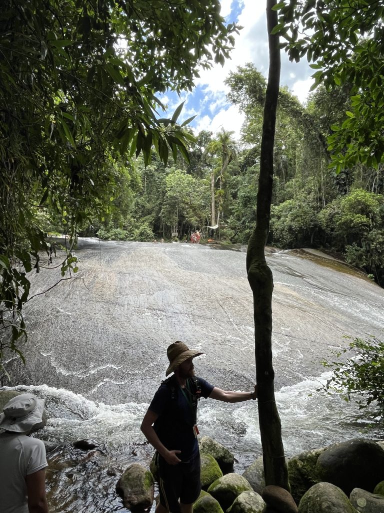 Wide smooth rock face of Tobogã waterfall in the jungle near Paraty, Brazil