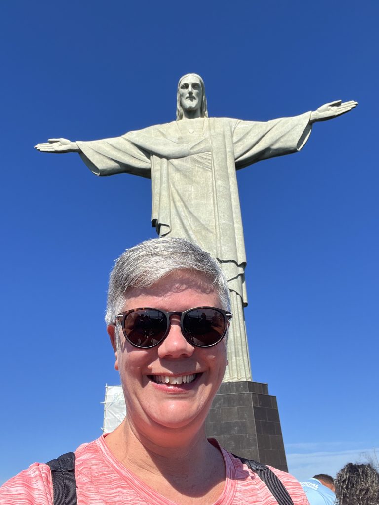 Selfie with the Christ the Redeemer statue towering overhead in Rio de Janeiro