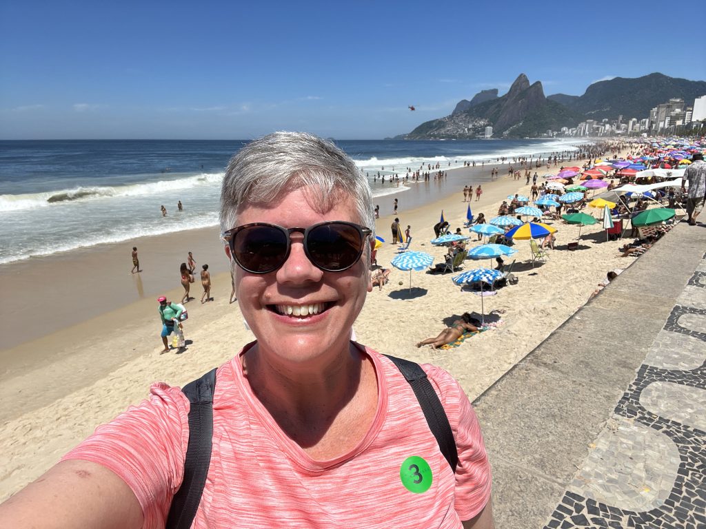 Selfie on the Ipanema Beach sidewalk with the Dois Irmãos twin peaks in the background in Rio de Janeiro