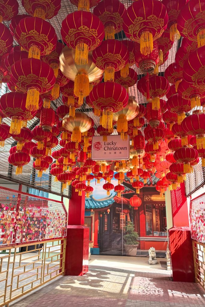 Red Chinese lanterns hanging densely from the ceiling at the entrance to Lucky Chinatown Mall in Manila
