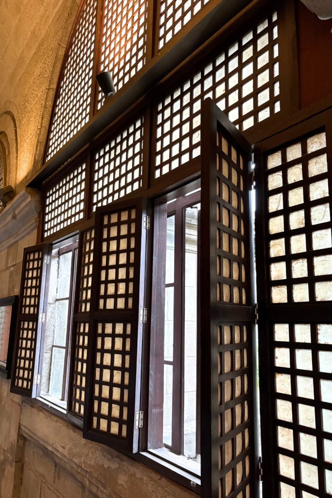 Capiz shell windows in wooden lattice frames at San Agustin Church cloister museum in Intramuros