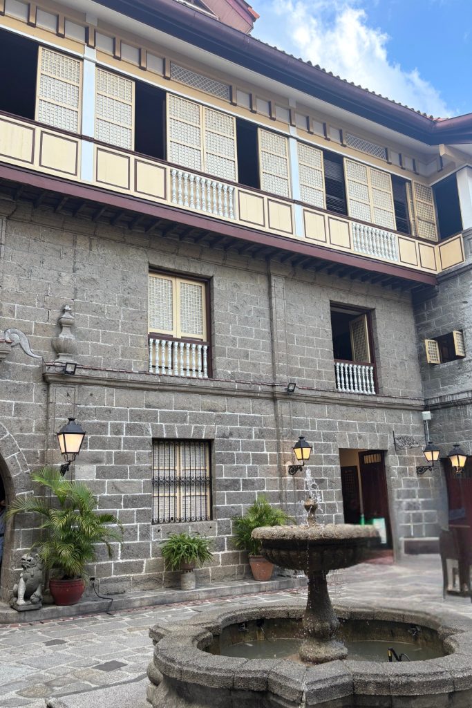 Stone courtyard and fountain at Casa Manila, a colonial-era house museum in Intramuros, Manila