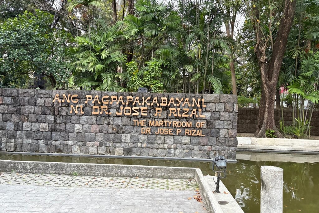 Stone marker inscribed "The Martyrdom of Dr. Jose P. Rizal" at Rizal Park, Manila